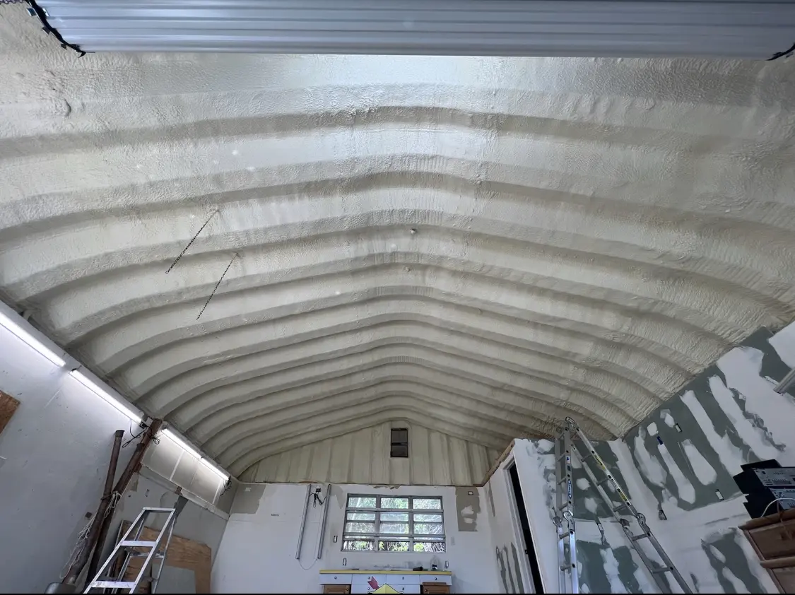 Spray polyurethane foam applied to the underside of a metal roof deck in Dublin